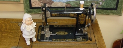 gnome with sewing machine